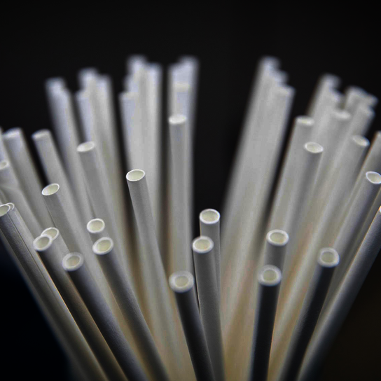 Paper straws, produced by Körber's Psios machine, with green biodegradable filter and 100% compostable logo.