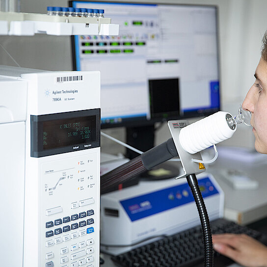 Employee uses gas chromatography-mass spectrometry for precise measurements and analyses.